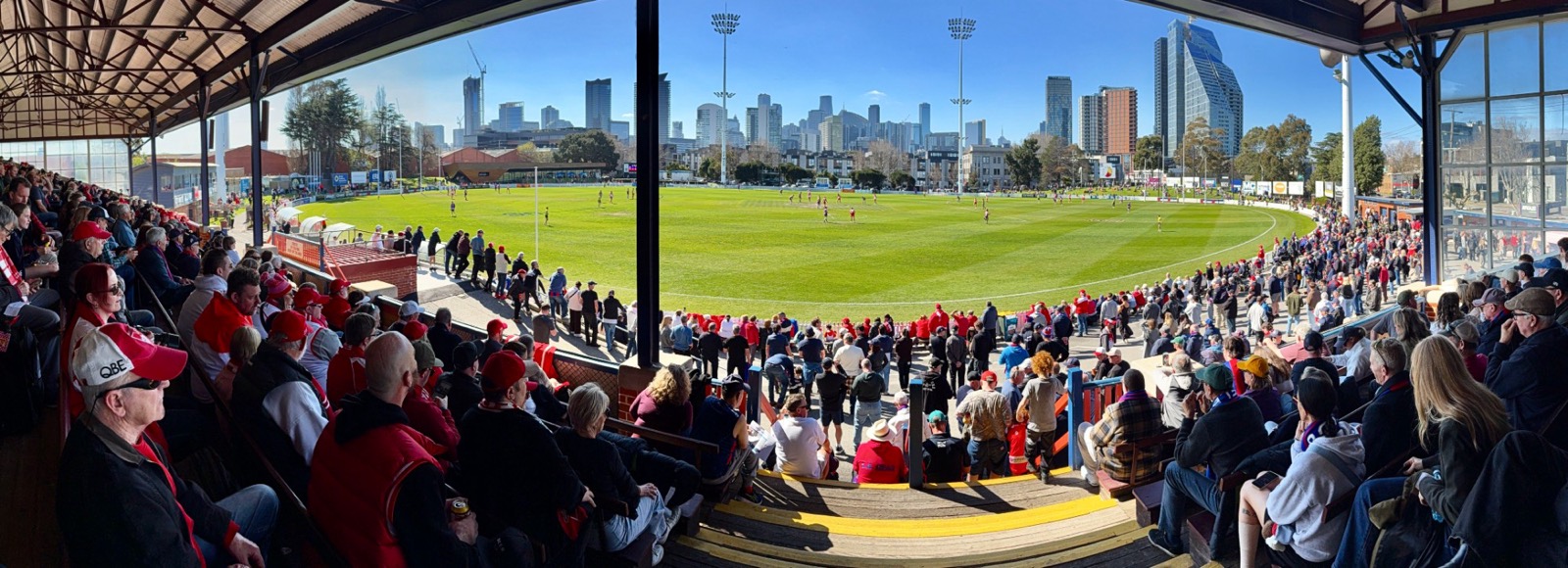 Panoramic view from a packed grandstand at an Australian rules football match