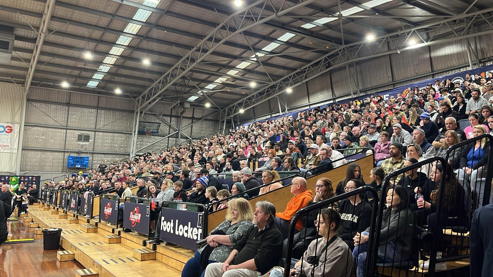 A full stand courtside at an NBL1 basketball game