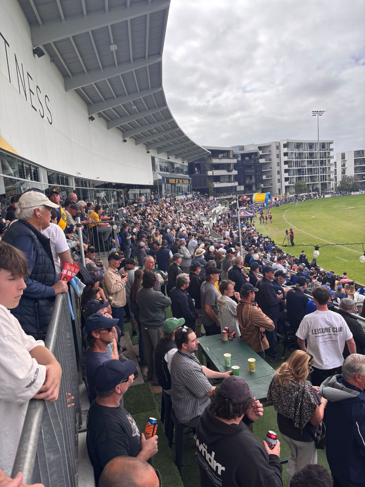 Fans lining the terrace at a West Australian football match